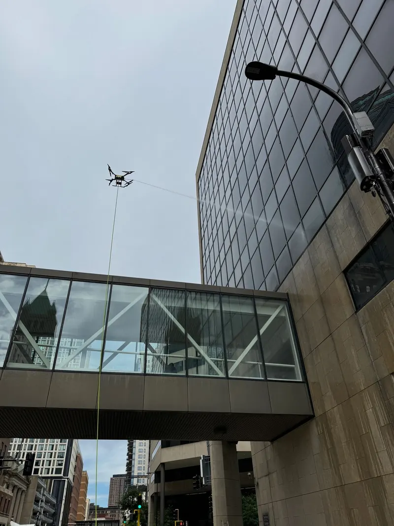 Drone cleaning the windows of the Expansive TriTech Center in Minneapolis